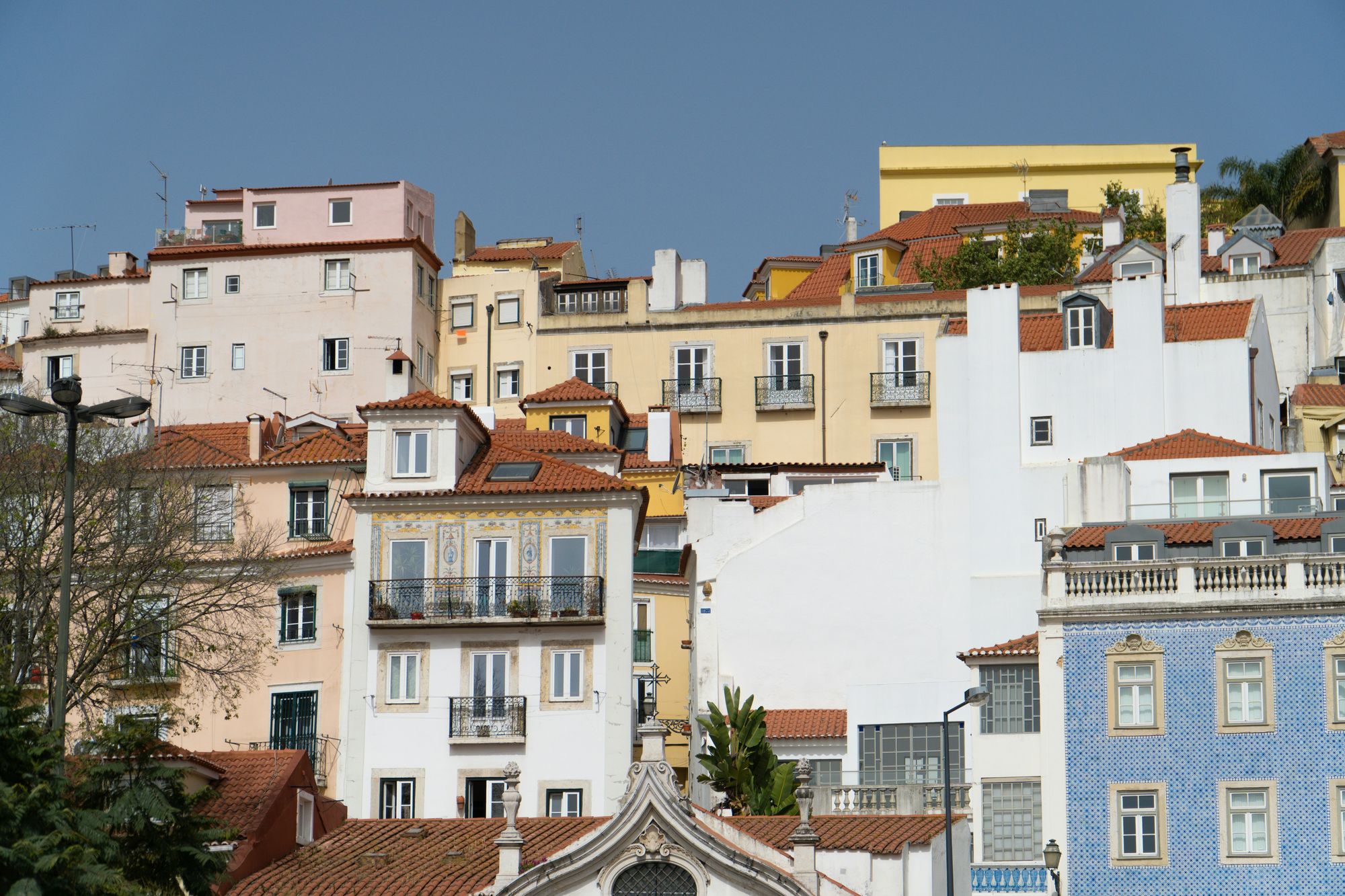 Stacked houses with iron balconies in Alfama